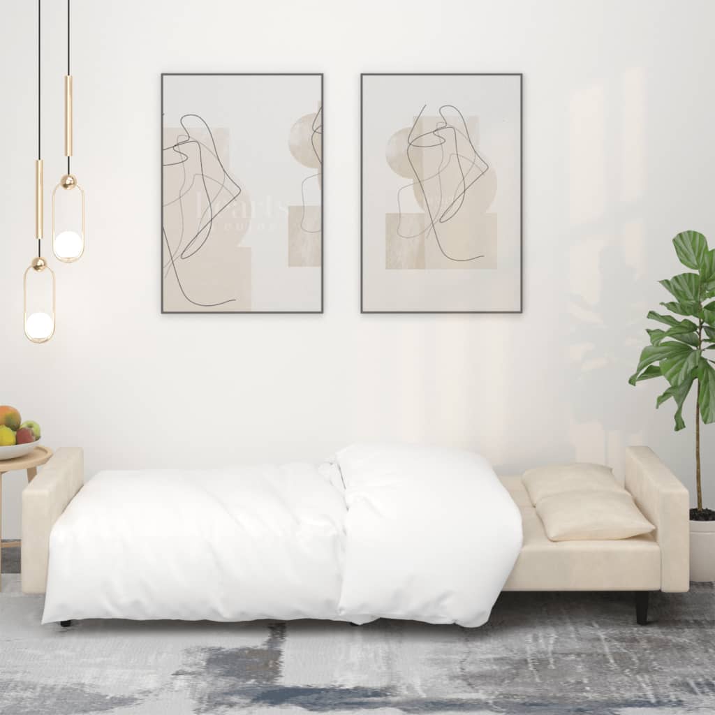 Kétszemélyes krémszínű bársony kanapéágy két párnával